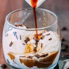 Pouring espresso over ice cream for affogato