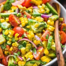 Avocado Corn Salad in a Serving bowl with Spoon