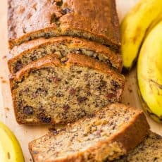 Sliced moist banana nut bread with overripe bananas