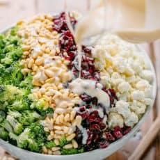 broccoli cauliflower salad drizzled with creamy dressing