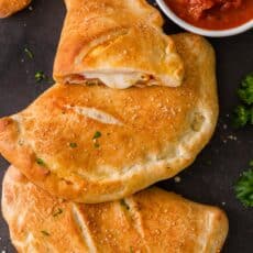 Baked Calzones served with marinara sauce