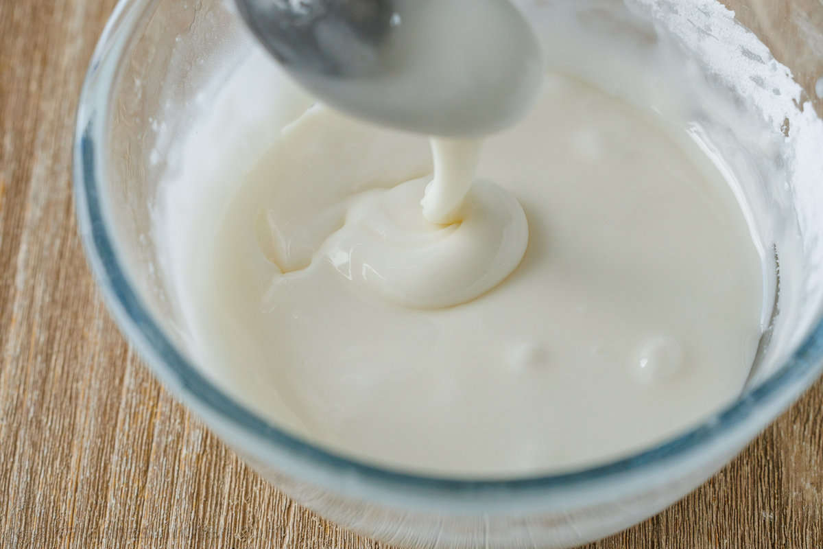 homemade icing in a small glass bowl