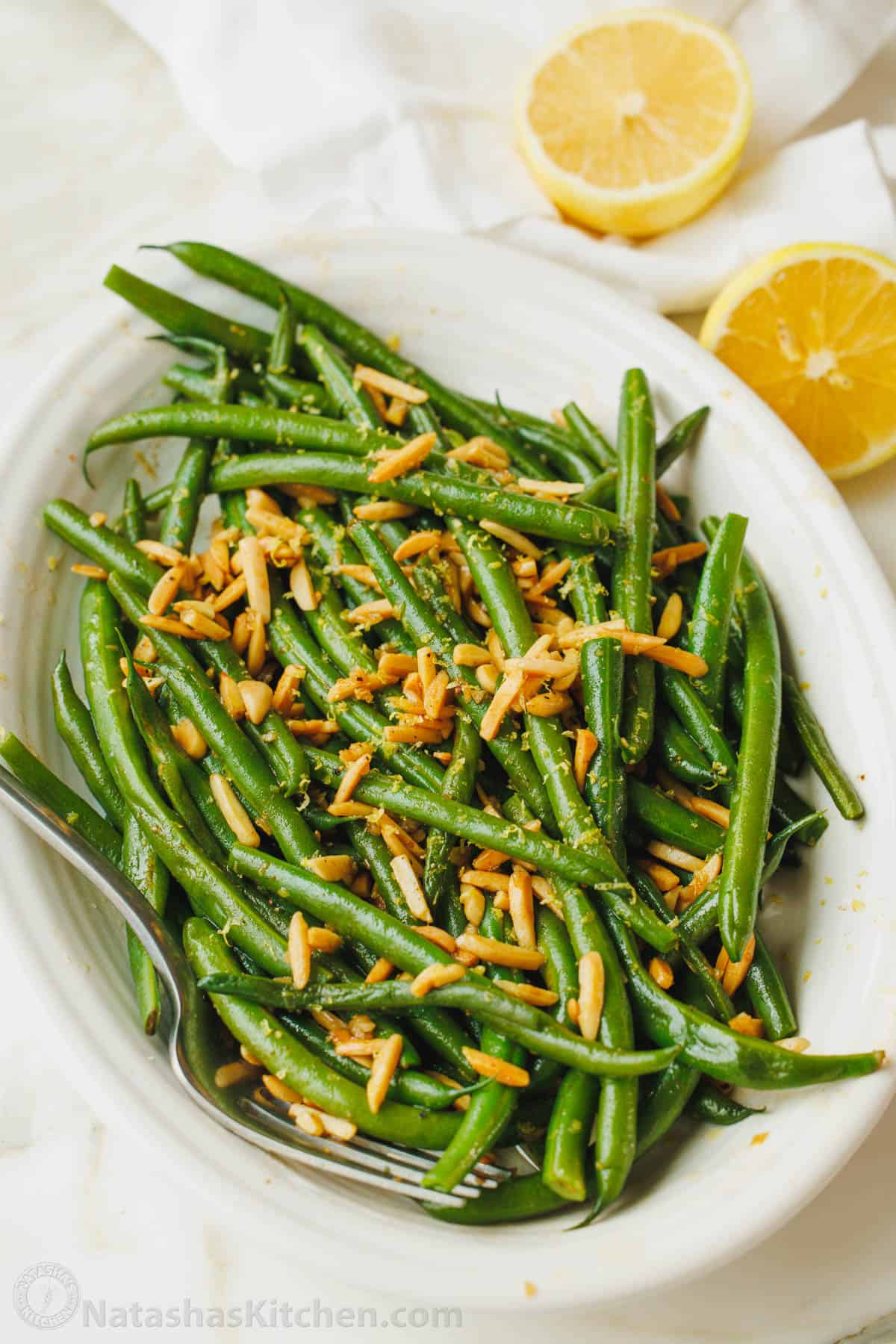 green beans with almonds for thanksgiving in a white dish