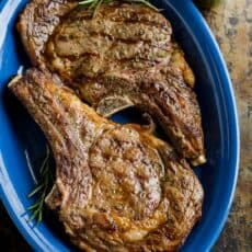 Grilled Steak on blue platter served with chimichurri sauce