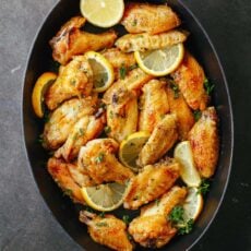 Lemon Pepper wings served with lemon wedges