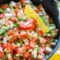 Pico De gallo in a serving bowl with tortilla chips