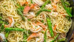 Shrimp Scampi Pasta with Asparagus has a lemon garlic and herb sauce that packs so much fresh and amazing flavor. A 30 minute shrimp scampi pasta recipe! | natashaskitchen.com