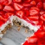 This strawberry pretzel salad is always a hit at parties. It's a strawberry jello dessert that is dangerously good! It's sweet, salty, tart and irresistible!