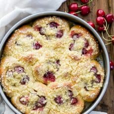 These sweet cherry filled buns (vatrushki) are soft and fluffy. They kind of melt in your mouth and you won't be able to stop at just one.