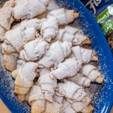 My Mother is famous for her Rugelach Recipe! These walnut-cranberry-apricot rugelach cookies are soft, crumbly, flaky, loaded! They always disappear fast! | natashaskitchen.com